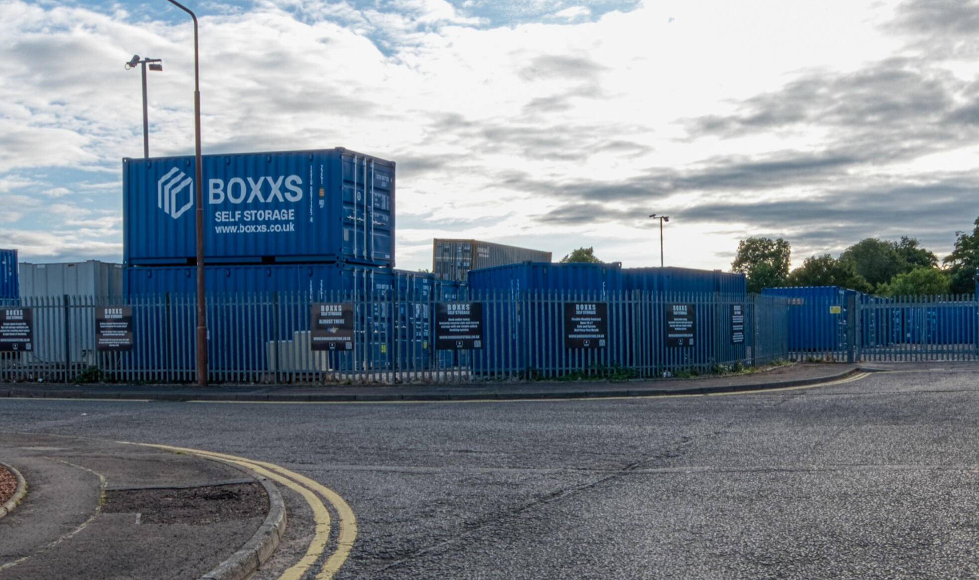 Alternate angle of Boxxs self storage container with painted logo at the Linlithgow entrance, highlighting secure access for Bo’ness and West Lothian customers